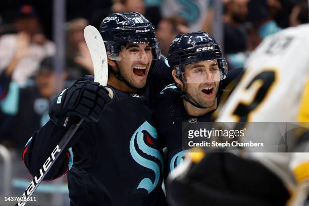 Matty Beniers and Jordan Eberle of the Seattle Kraken celebrate a goal by Eberle during the second period of the game against the Pittsburgh Penguins...