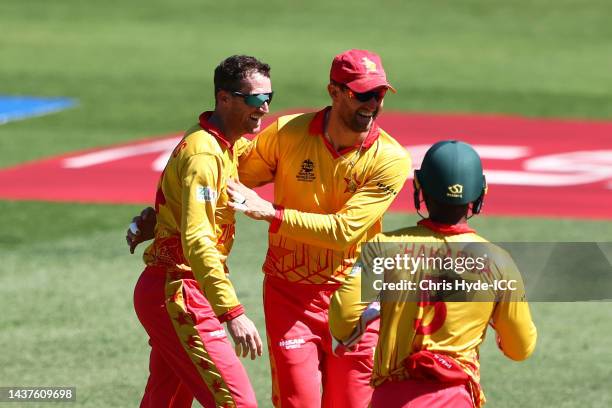 Sean Williams of Zimbabwe celebrates with team mates after taking the wicket of Shakib Al Hasan of Bangladesh during the ICC Men's T20 World Cup...