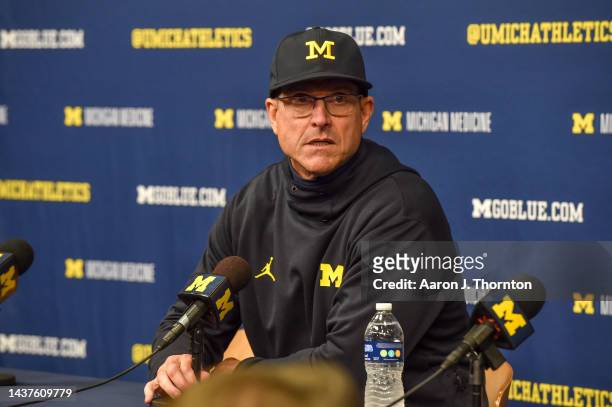 Head Football Coach Jim Harbaugh of the Michigan Wolverines speaks to the press after a college football game against the Michigan State Spartans at...