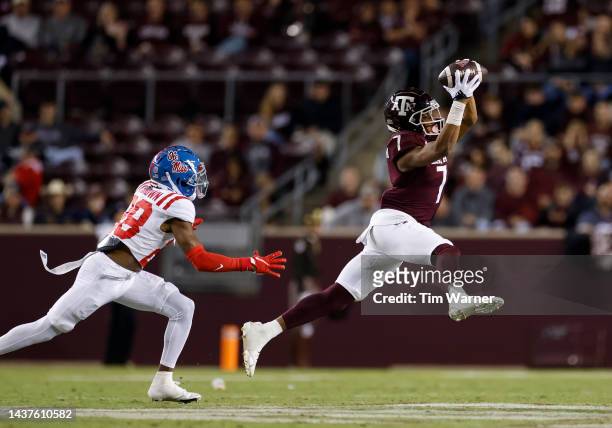 Moose Muhammad III of the Texas A&M Aggies catches a pass in front of Markevious Brown of the Mississippi Rebels in the second half of the game at...