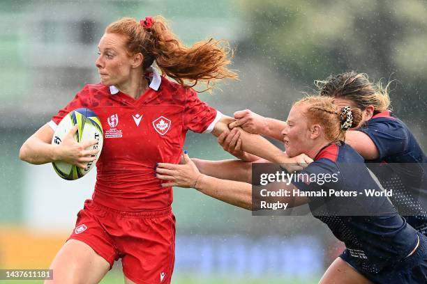 Alex Tessier of Canada is tackled during the Rugby World Cup 2021 New Zealand Quarterfinal match between Canada and USA at Waitakere Stadium on...