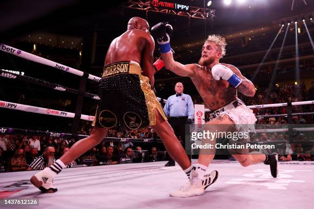 Jake Paul punches Anderson Silva of Brazil during their cruiserweight bout at Desert Diamond Arena on October 29, 2022 in Glendale, Arizona.