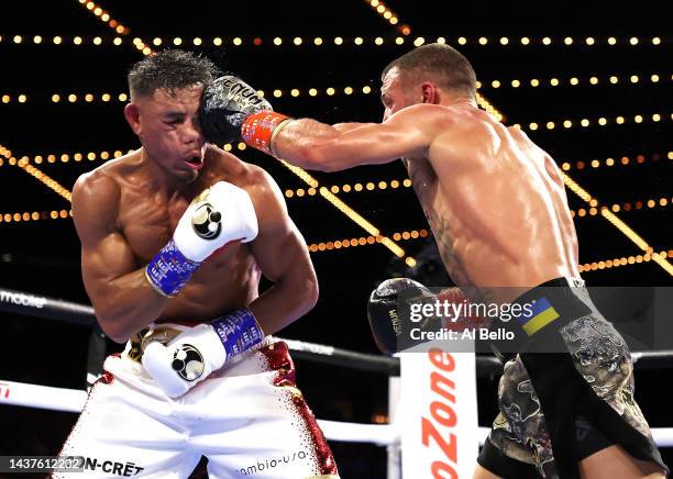 Vasiliy Lomachenko punches Jamaine Ortiz during their lightweight bout at The Hulu Theater at Madison Square Garden on October 29, 2022 in New York...