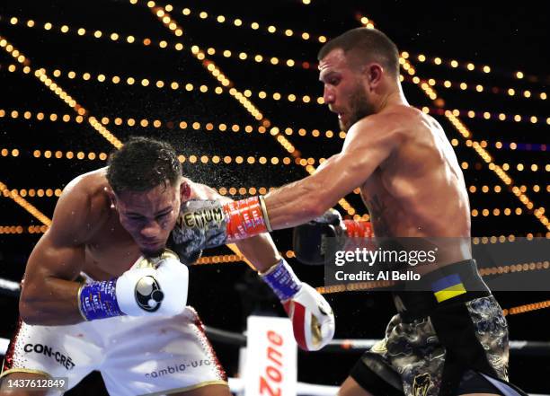 Vasiliy Lomachenko punches Jamaine Ortiz during their lightweight bout at The Hulu Theater at Madison Square Garden on October 29, 2022 in New York...