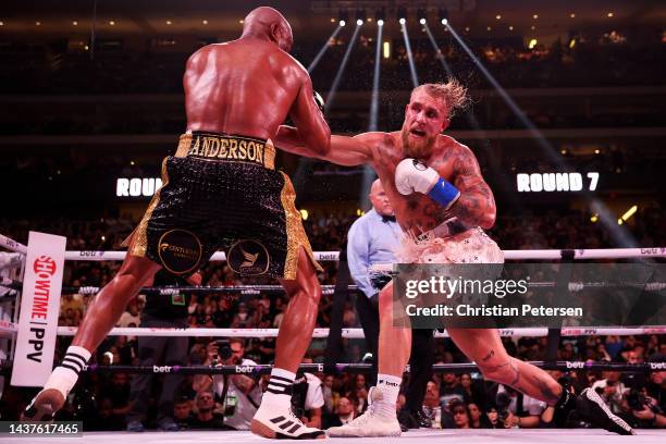 Jake Paul punches Anderson Silva of Brazil during their cruiserweight bout at Desert Diamond Arena on October 29, 2022 in Glendale, Arizona.