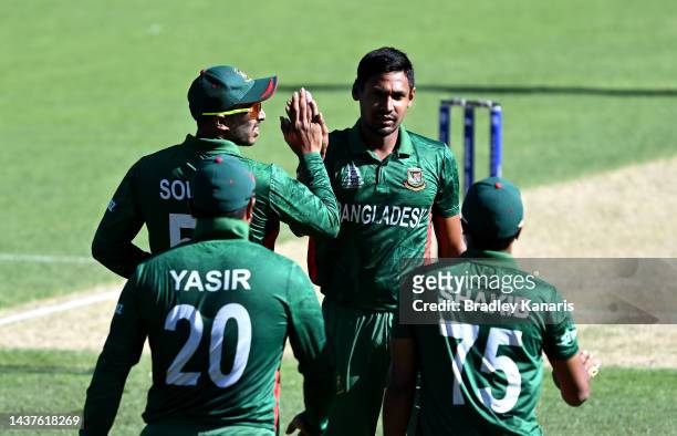 Mustafizur Rahman of Bangladesh celebrates with team mates after taking the wicket of Milton Shumba of Zimbabwe during the ICC Men's T20 World Cup...