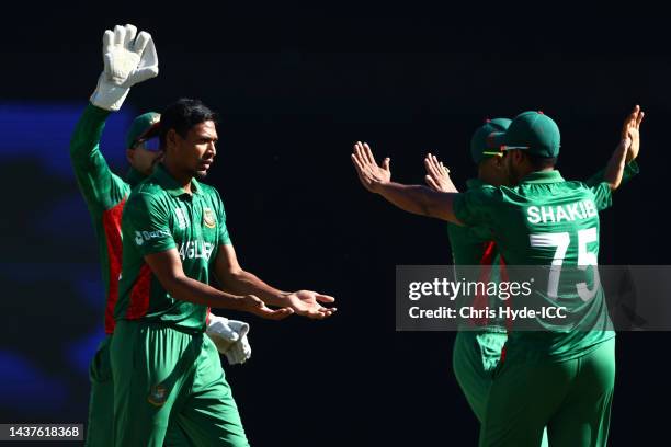 Mustafizur Rahman of Bangladesh celebrates with team mates after taking the wicket of Sikandar Raza of Zimbabwe during the ICC Men's T20 World Cup...