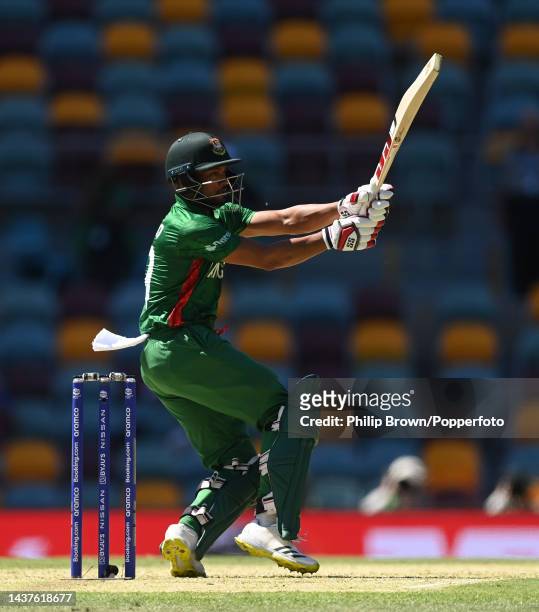 Najmul Hossain Shanto of Bangladesh hits out during the ICC Men's T20 World Cup match between Bangladesh and Zimbabwe at The Gabba on October 30,...