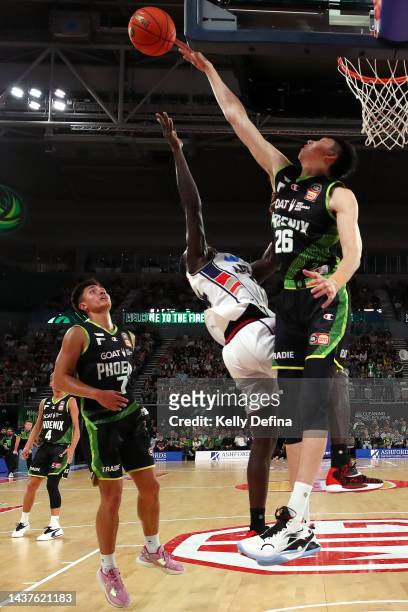 Zhou Qi of the Phoenix blocks Sunday Dech of the 36ers during the round five NBL match between South East Melbourne Phoenix and Adelaide 36ers at...