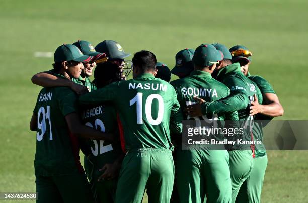 The Bangladesh players celebrate victory after the ICC Men's T20 World Cup match between Bangladesh and Zimbabwe at The Gabba on October 30, 2022 in...