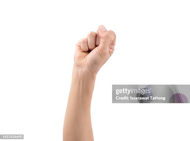 close up asian female hand show stranglehold, arm and hand isolated on a white background - clenched fist stockfoto's en -beelden