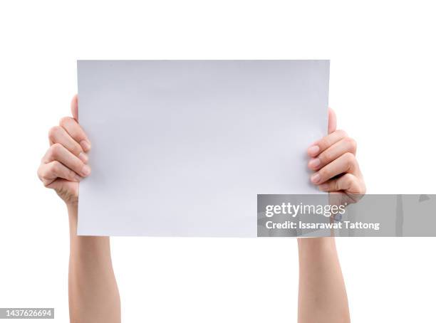 female hand holding a virtual card with your fingers on a white background - pancarte de manifestation photos et images de collection