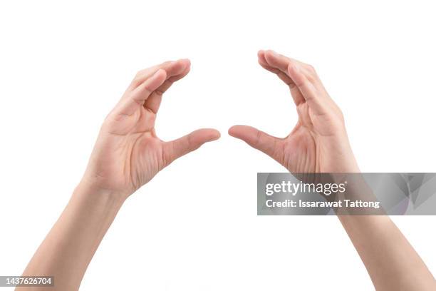 empty hands show gestures holding a burger, sandwich, or some food isolated on white background. - hand holding object stock-fotos und bilder