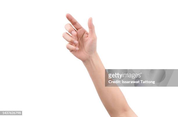 man's hand touching or pointing to something isolated on white background. close up. - pouce fond blanc photos et images de collection