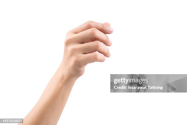 a hand holding something like a bottle or smartphone on white backgrounds, isolated - man holding his hand out stockfoto's en -beelden