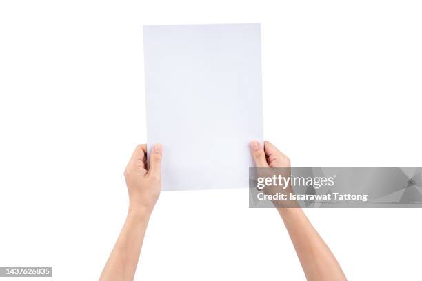 female hand holding a virtual card with your fingers on a white background - person holding blank piece of paper stock pictures, royalty-free photos & images