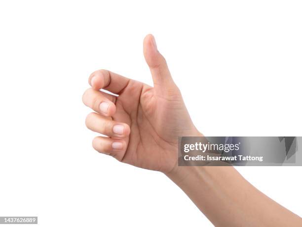 a hand holding something like a bottle or smartphone on white backgrounds, isolated - main tenant une bouteille photos et images de collection