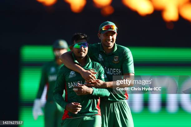 Musaddek Hossain and Taskin Ahmed of Bangladesh celebrate victory after the ICC Men's T20 World Cup match between Bangladesh and Zimbabwe at The...