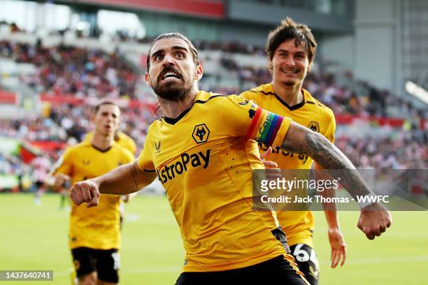 Ruben Neves of Wolverhampton Wanderers celebrates after scoring his team's first goal during the Premier League match between Brentford FC and...
