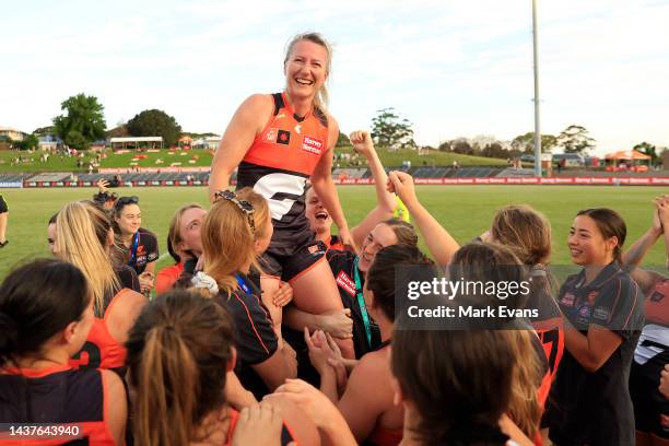 Tanya Hetherington of the Giants is held aloft by her team mates after the round 10 AFLW match between the Greater Western Sydney Giants and the Gold...