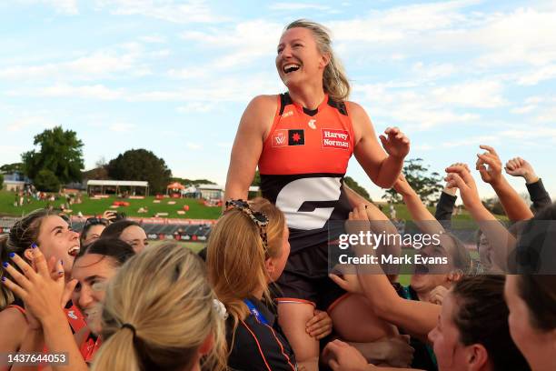 Tanya Hetherington of the Giants is held aloft by her team mates after the round 10 AFLW match between the Greater Western Sydney Giants and the Gold...