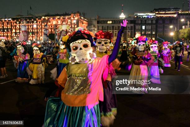 Carnival of people dressed as typical characters of Mexican culture parade through through during the 'Day of The Dead Festival' at Zocalo on October...