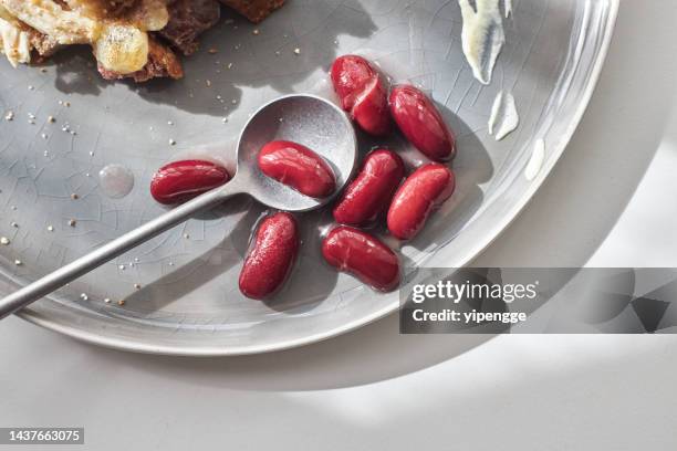 red kidney beans on plate - red bean stock pictures, royalty-free photos & images