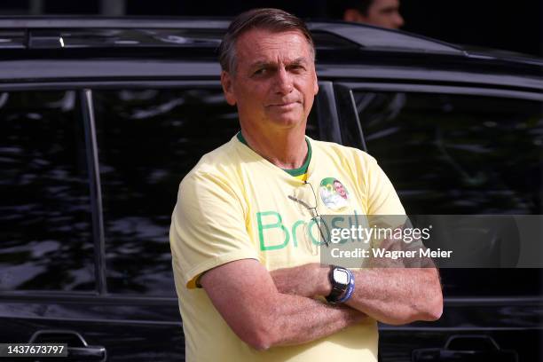 Incumbent Jair Bolsonaro of Liberal Party , who is running for another term, arrives to cast his vote at Vila Militar district on October 30, 2022 in...