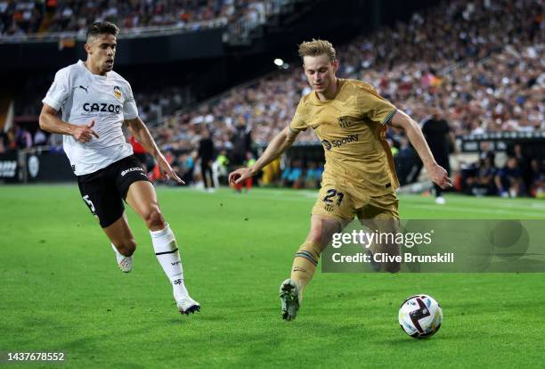 Frenkie de Jong of FC Barcelona is put under pressure by Gabriel Paulista of Valencia CF during the LaLiga Santander match between Valencia CF and FC...