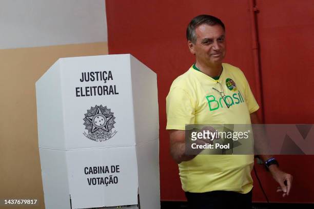 Incumbent Jair Bolsonaro of Liberal Party , who is running for another term, casts his vote at Vila Militar district on October 30, 2022 in Brasilia,...