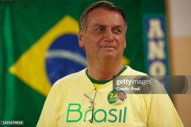 Incumbent Jair Bolsonaro of Liberal Party , who is running for another term, casts his vote at Vila Militar district on October 30, 2022 in Brasilia,...