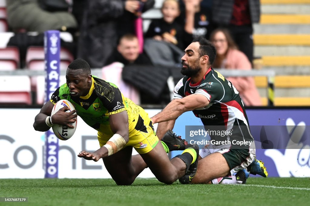 Mo Rugby Mo Agoro of Jamaica goes over to score their sides first try during ...