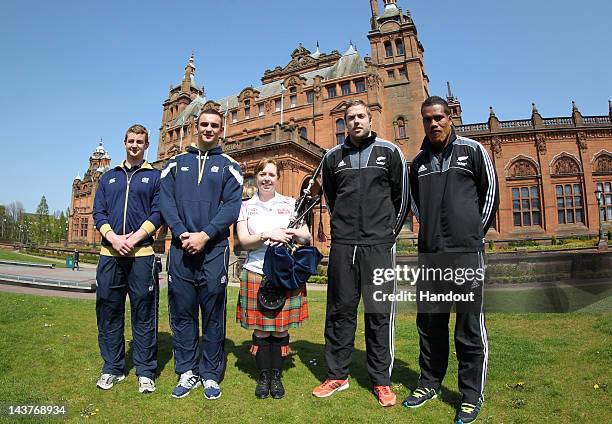 In this handout image provided by HSBC, Lote Raikabula and Tim Mikkelson from New Zealand, with Struan Dewar and Adam Ashe from Scotland Sevens learn...