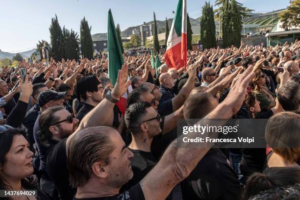 Fascist sympathisers do the Saluto Romano outside the cemetery of San Cassiano, where Benito Mussolini is buried, as Italians mark one hundred years...