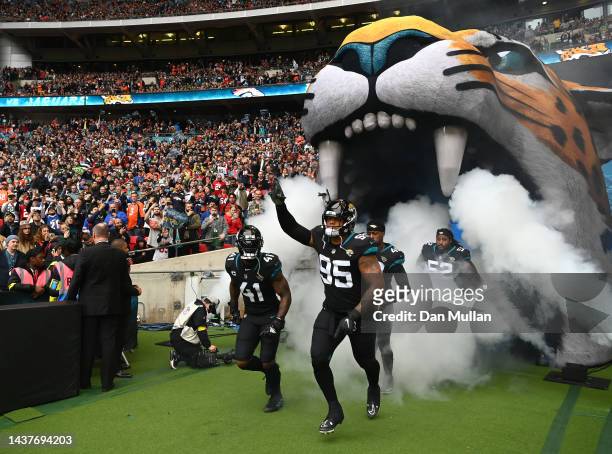 Roy Robertson-Harris and Josh Allen of the Jacksonville Jaguars run out onto the field during the NFL match between Denver Broncos and Jacksonville...