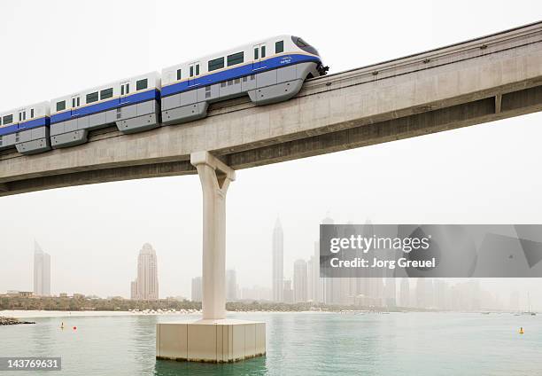 palm jumeirah monorail - dubai bridge stock pictures, royalty-free photos & images