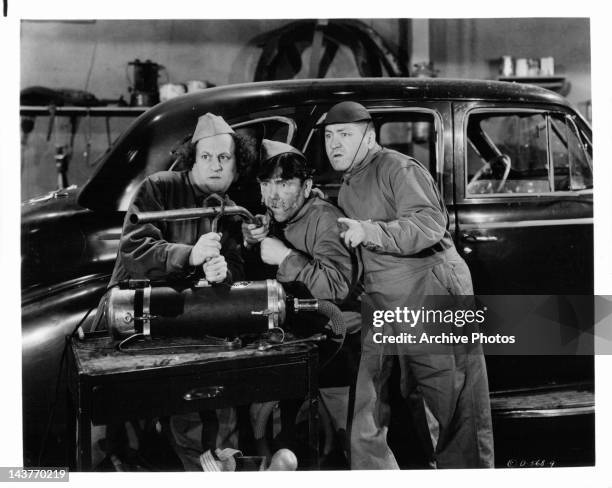 Larry Fine, Moe Howard, and Curly Howard as the Three Stooges in a scene from uknown film, Circa 1940.