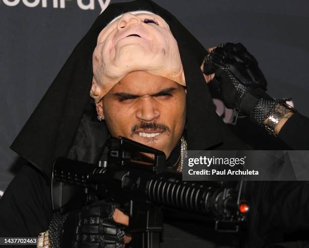 Singer Chris Brown attends the CARN*EVIL Halloween Party at a private residence on October 29, 2022 in Los Angeles, California.