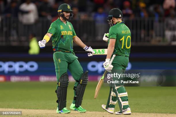 Wayne Parnell and David Miller of South Africa celebrate winning the ICC Men's T20 World Cup match between India and South Africa at Perth Stadium on...