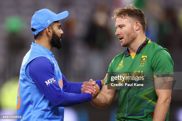 Virat Kohli of India and David Miller of South Africa share a moment following the ICC Men's T20 World Cup match between India and South Africa at...