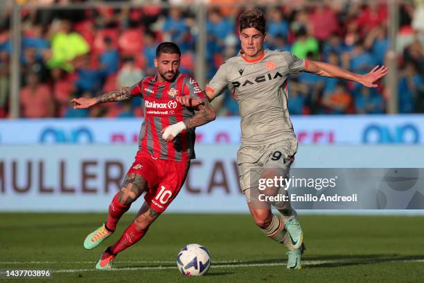 Cristian Buonaiuto of US Cremonese is challenged by Jaka Bijol of Udinese Calcio during the Serie A match between US Cremonese and Udinese Calcio at...