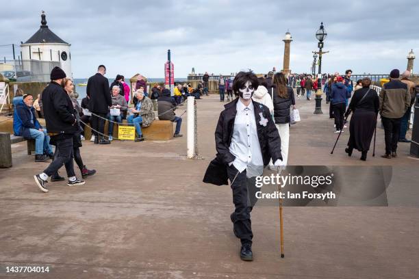 Youngster in costume attends Whitby Goth Weekend on October 30, 2022 in Whitby, England. The Whitby Goth weekend began in 1994 and takes place twice...