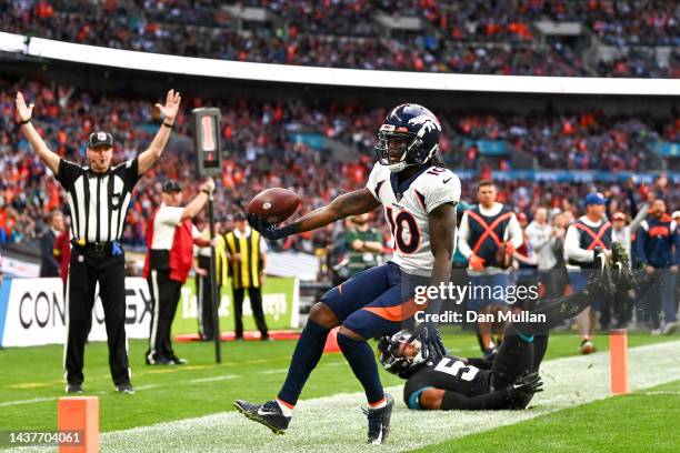 Jerry Jeudy of the Denver Broncos runs in for the touchdown against Jacksonville Jaguars during second quarter in the NFL match between Denver...