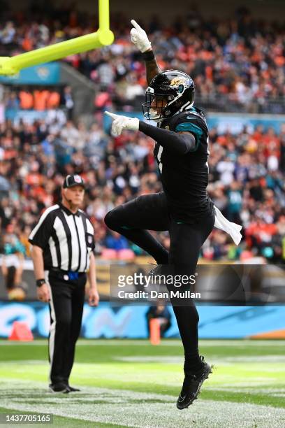 Evan Engram of the Jacksonville Jaguars celebrates after scoring a touchdown against the Denver Broncos during the first quarter in the NFL match...