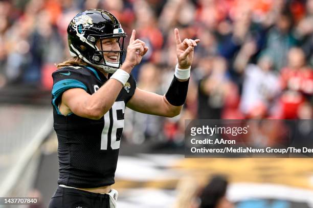 Trevor Lawrence of the Jacksonville Jaguars celebrates a touchdown pass to Evan Engram against the Denver Broncos during the first quarter at Wembley...