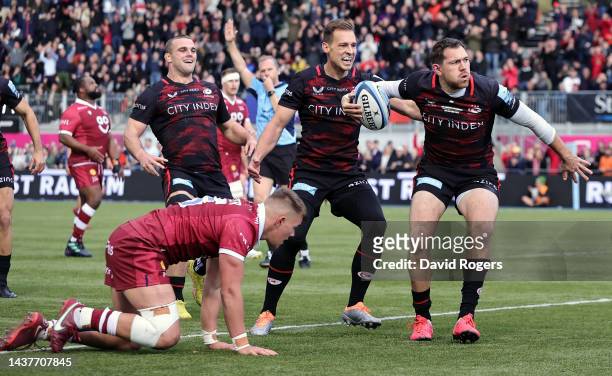 Alex Goode of Saracens celebrates after scoring their first try during the Gallagher Premiership Rugby match between Saracens and Sale Sharks at the...
