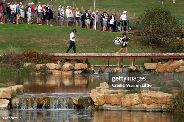 Gavin Green of Malaysia crosses the bridge to the fairway on the 14th hole during Day Four of the Portugal Masters at Dom Pedro Victoria Golf Course...