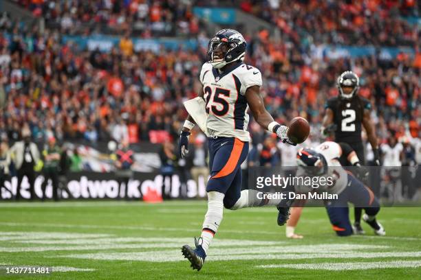 Melvin Gordon III of the Denver Broncos celebrates after scoring their second touchdown in the second half during the NFL match between Denver...