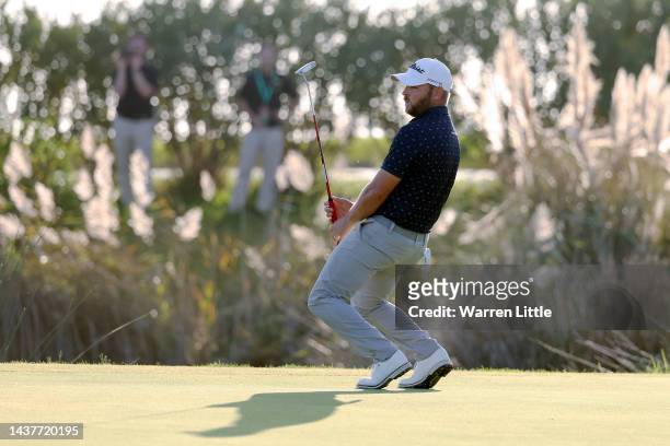 Jordan Smith of England reacts after putting on the 18th hole during Day Four of the Portugal Masters at Dom Pedro Victoria Golf Course on October...