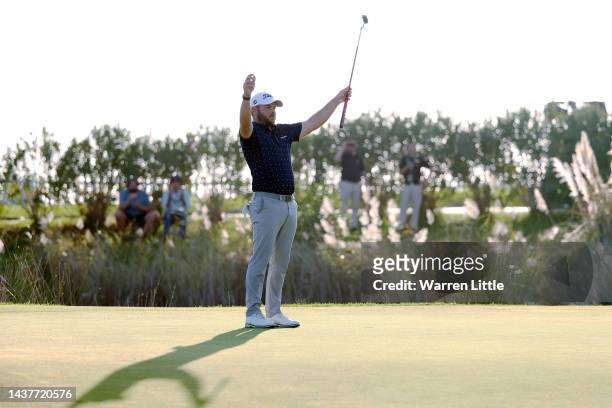 Jordan Smith of England reacts after putting on the 18th green during Day Four of the Portugal Masters at Dom Pedro Victoria Golf Course on October...